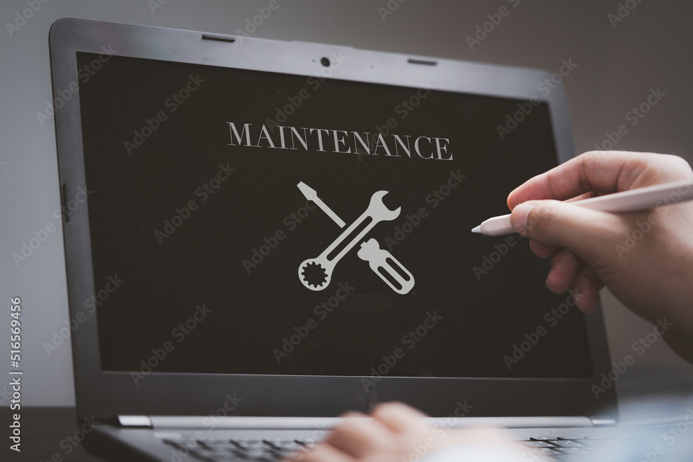 Poster businessman using computer laptop with maintenance sign on monitor screen for technical support cust