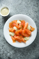 Traditional smoked salmon with dill sauce