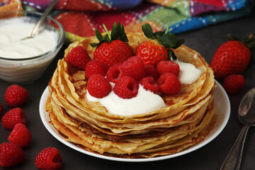 Russian cuisine national dish bliny with fresh berries	