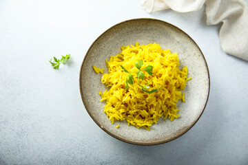 Healthy vegan turmeric rice with fresh parsley
