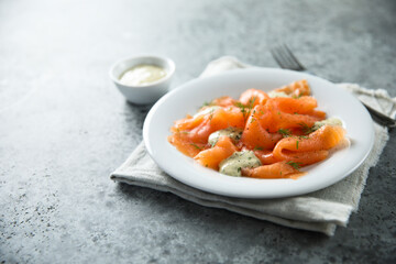 Traditional smoked salmon with dill sauce