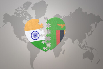 puzzle heart with the national flag of india and zambia on a world map background.Concept.