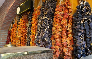 Dried eggplants and peppers in bazaar in Gazi Antep. Turkish dried foods. Aubergine and paprika,...