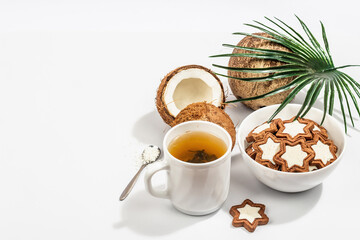Gluten-free and lactose-free coconut cookies. Homemade healthy pastries, green tea, sunny morning