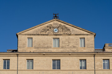 Detail view of the ancient stone facade of Hotel de Massilian, an historic building home of the Musee Fabre, a famous landmark of Montpellier, France