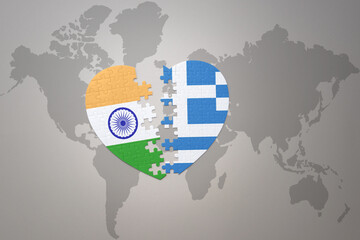 puzzle heart with the national flag of india and greece on a world map background.Concept.