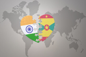 puzzle heart with the national flag of india and grenada on a world map background.Concept.