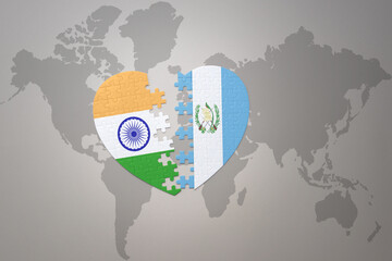 Fototapeta na wymiar puzzle heart with the national flag of india and guatemala on a world map background.Concept.