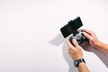 Hands with joystick with phone © stenkovlad