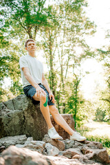 Sportsman resting after workout outdoors