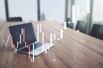 Double exposure of abstract creative financial chart on modern laptop background, research and strategy concept