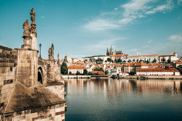 Fototapeta premium Prague, Czech republic. Beautiful view to Vltava river. Charles bridge - Karluv Most and medieval gothic architecture on opposite coast.