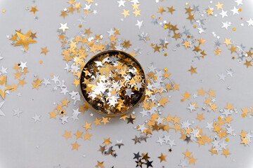 golden confetti in tin jar top view
