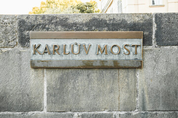 Brass name sign of Karluv Most - Charles bridge in Prague, Czech Republic.