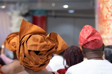 Fototapeten Nigerian american woman gele headtie at wedding © primestockphotograpy