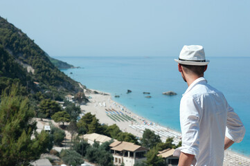 Fototapeta na wymiar Man is enjoying his vacation in Greece 