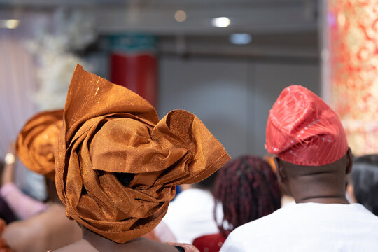 Nigerian american woman gele headtie at wedding