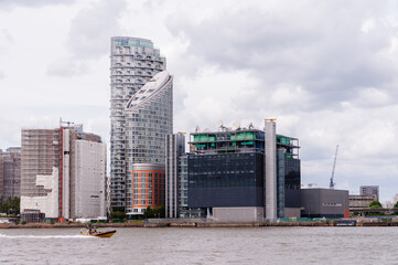 Canary Wharf financial district on the Isle of Dogs, seen from the Greenwich Peninsula in London,...