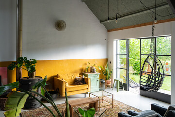 Trendy Boho eclectic interior with vintage furniture. High quality photo
