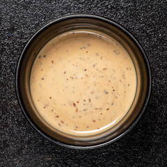 sesame sauce on the black background