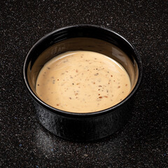 sesame sauce on the black background