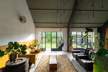 Trendy Boho eclectic interior with vintage furniture. High quality photo