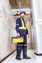 Maintenance engineer inspect relay protection system with laptop tablet computer. Electrician...