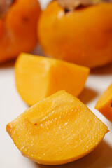 Fresh organic ripe Persimmons fruits on white 
