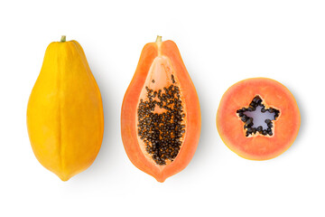 Whole and half sliced papaya fruit isolated on white background. Top view. Flat lay.