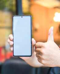 man thumbs up mobile phone with blank white screen