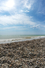 Fototapeta na wymiar Pebble beach in Novofedorovka with beautiful stones