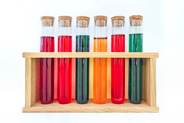 fuel additive. test tubes with colorful chemicals isolated on a white background