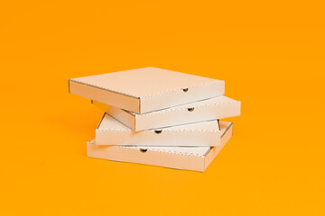pizza boxes on yellow background