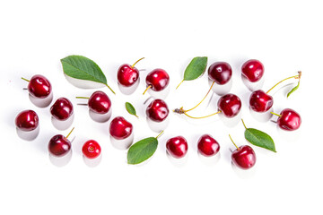 Fresh ripe raw cherry berry with leaf isolated on white background