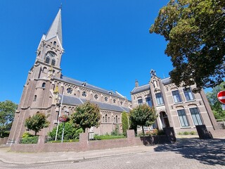 The Neo-Romanesque Catholic Ursula Church and historic building in Warmenhuizen, North Holland,...