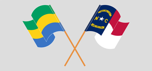 Crossed flags of Gabon and The State of North Carolina. Official colors. Correct proportion