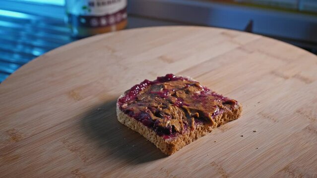 Low-calorie PBJ Sandwich. Whole Wheat Toast With Peanut Butter And Forest Fruit Jam Spread. rack focus