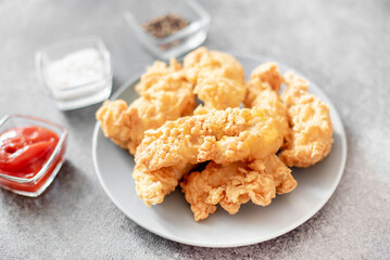 Chicken strips on stone background