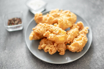 Chicken strips on stone background