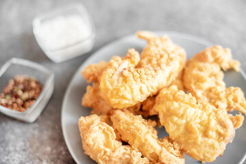 Chicken strips on stone background