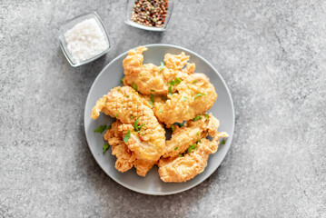Chicken strips on stone background