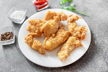 Chicken strips on stone background