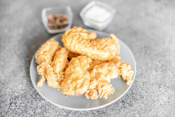 Chicken strips on stone background