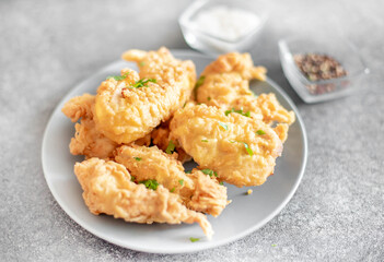 Chicken strips on stone background