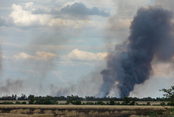 War in Ukraine. Fields of wheat in fire