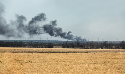 War in Ukraine. Fields of wheat in fire