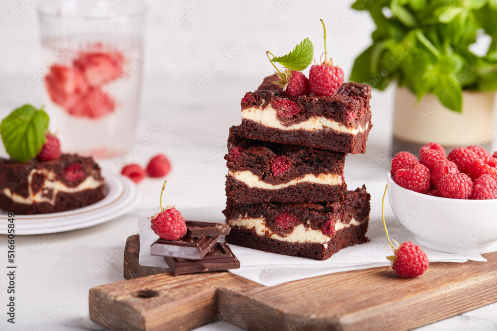 Canvas Prints Brownie cake bars with cheesecake layer, dark chocolate and raspberries. Delicious summer homemade dessert. 