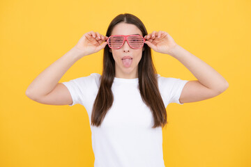 Surprised woman, shocking girl wearing funny glasses on isolated yellow background, Wow face...