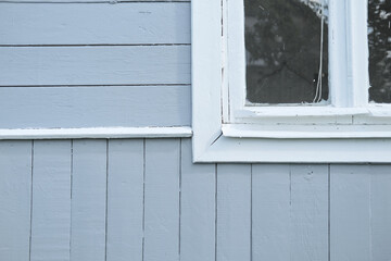 Obraz na płótnie Canvas corner white window frames of rustic wooden old house as background