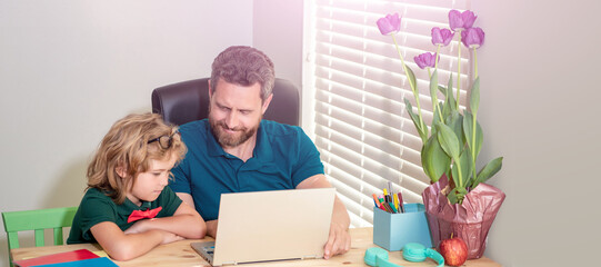 Banner of home school of father and son with laptop at home, cheerful father and child son at school working online on laptop, education